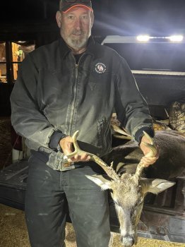 John King with a heavy horned buck.